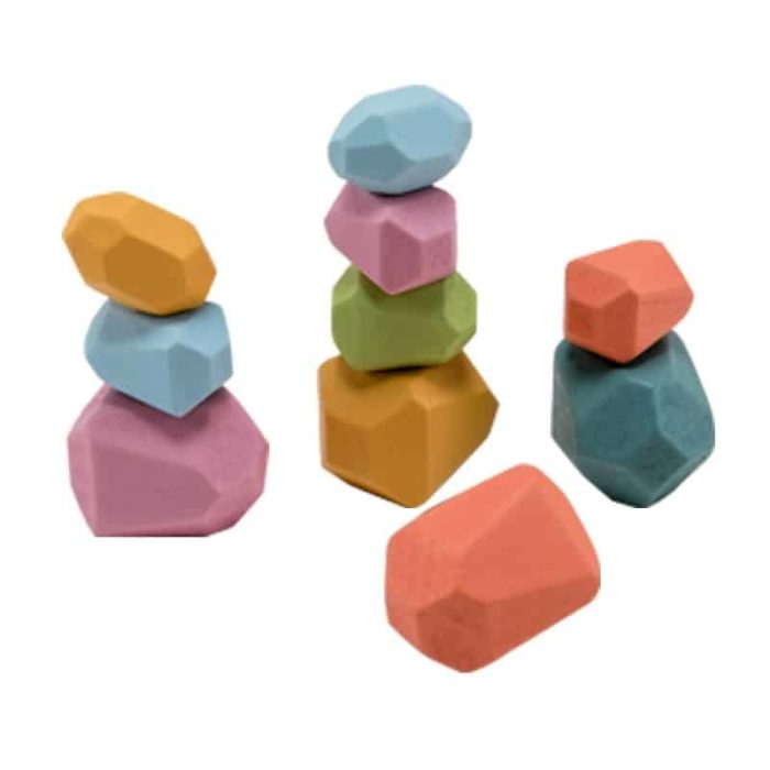 A set of wooden building blocks in the shape of coloured stones on a white background.