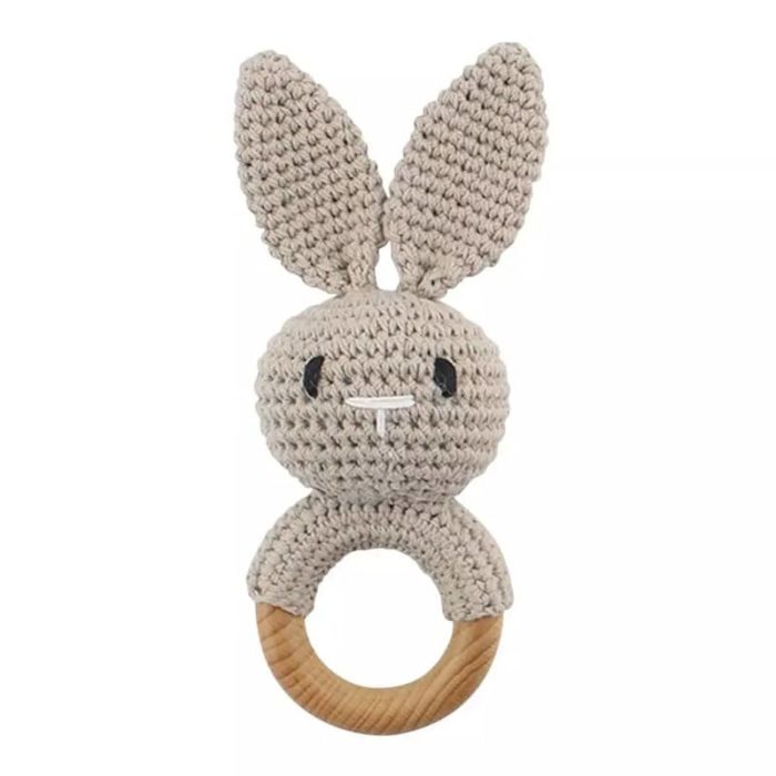 A knitted rabbit wooden rattle.
