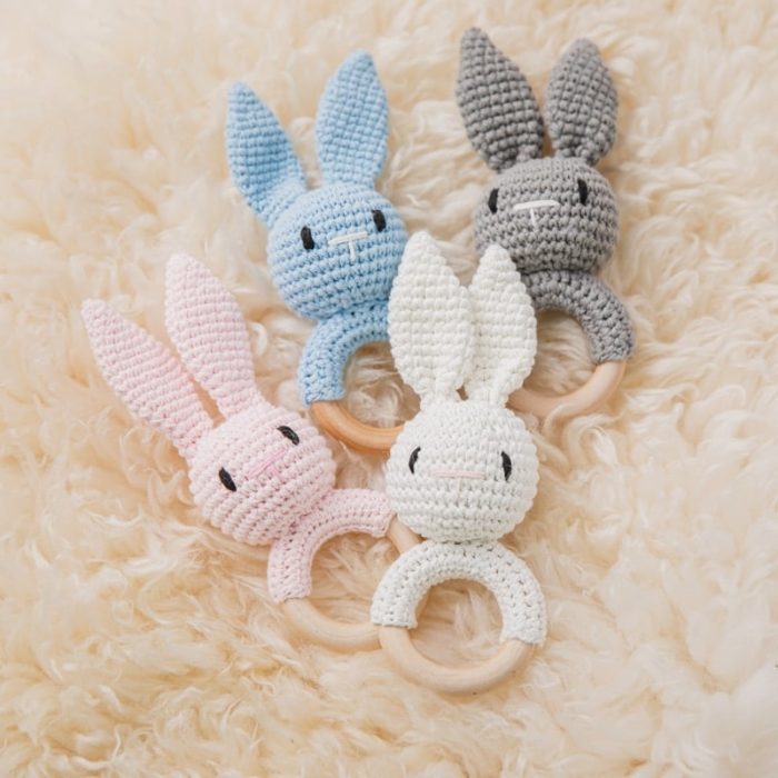 Knitted rabbit wooden rattle.