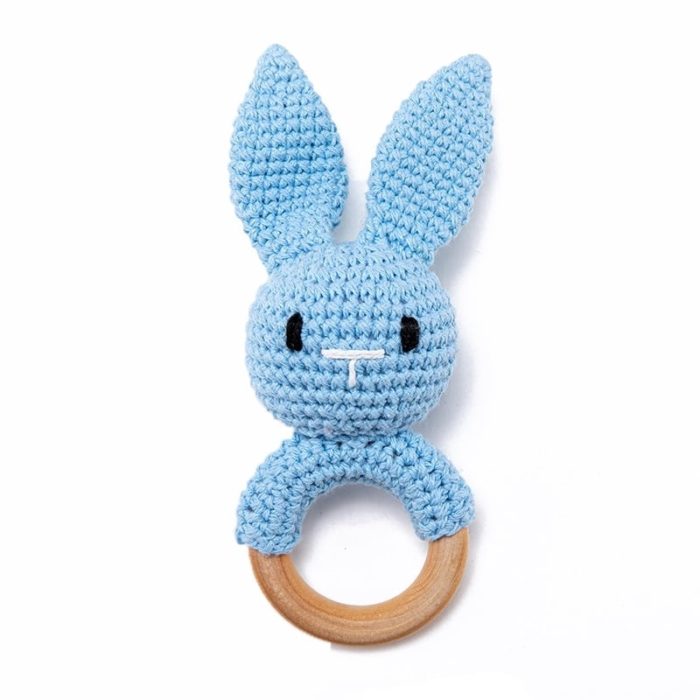 A knitted Rabbit Wooden Rattle crocheted on a white background.