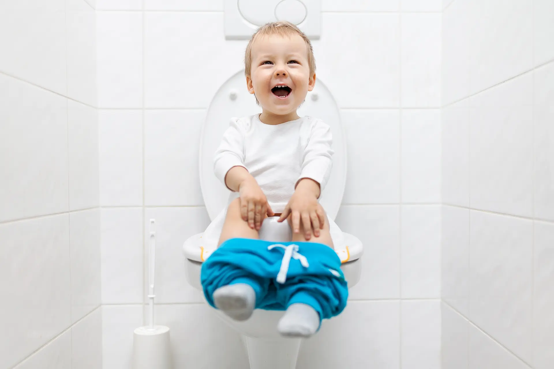 A baby learns potty training using the Montessori method.
