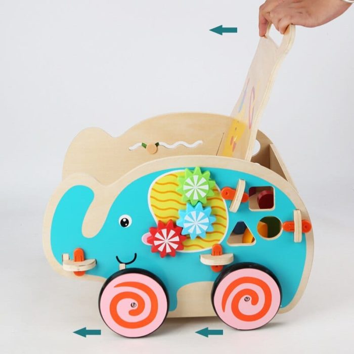 Un Chariot de Marche Pousseur - Éléphant avec un jouet coloré à l'intérieur en forme d'éléphant.