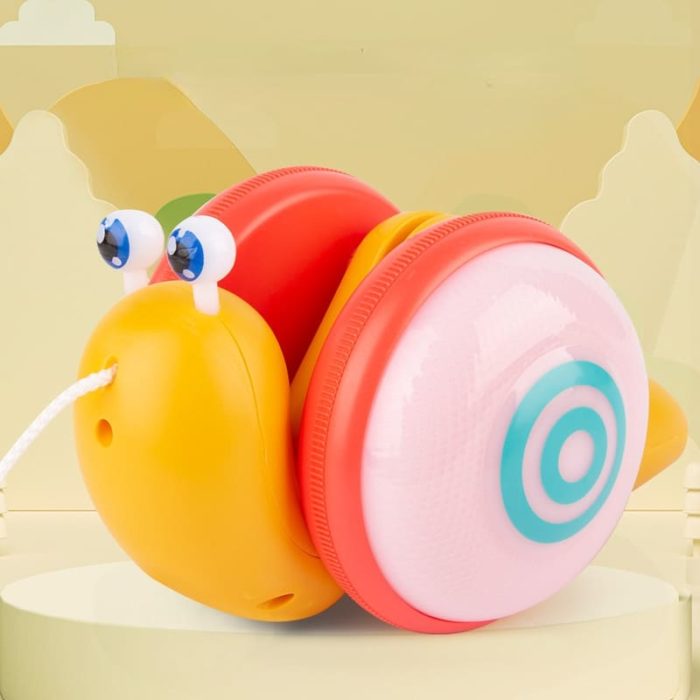 The Snail Musical pull game sits on top of a table.