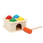 A 4 Hole Color Hammer Toy with balls and hammer.