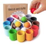 Set of wooden toys, balls and cups.