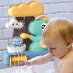 A baby plays with the Dinosaur Bath Toy - Animal Sprinkler.
