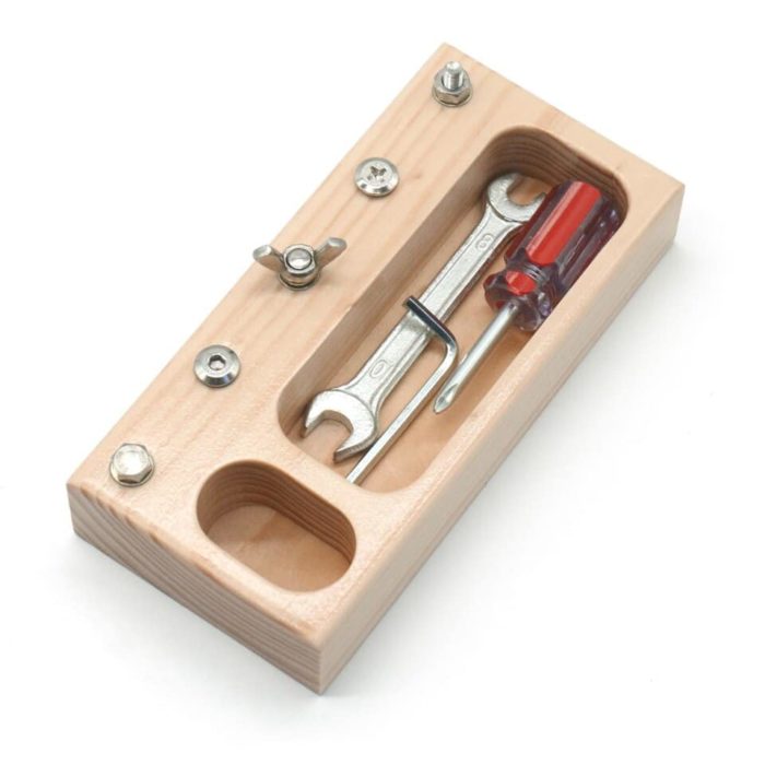 A wooden case with a Real Children's Screwdriver Tool and a screwdriver.