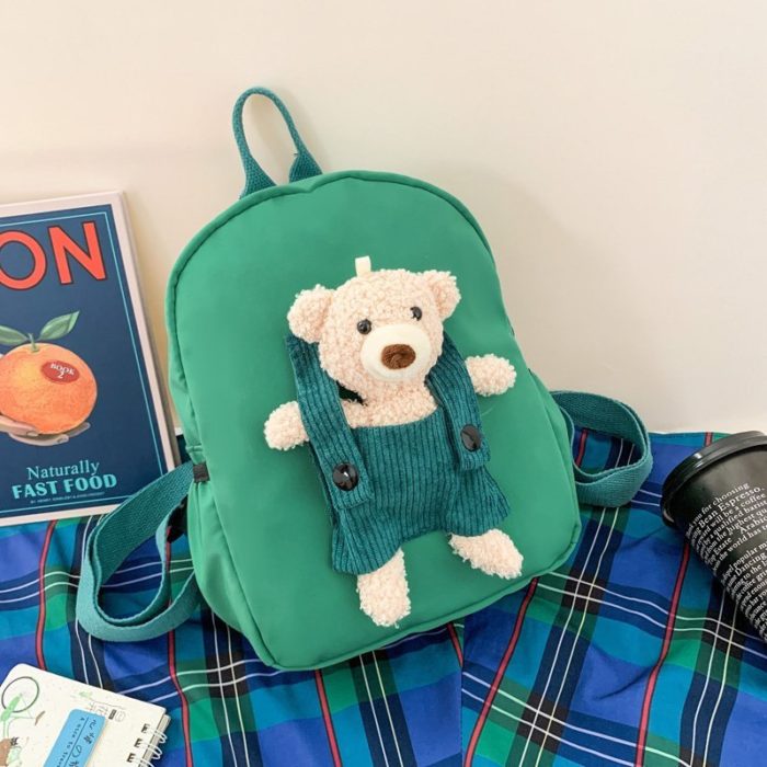 A green Personalized Teddy Bear Backpack for Boys and Girls with a teddy bear on it.