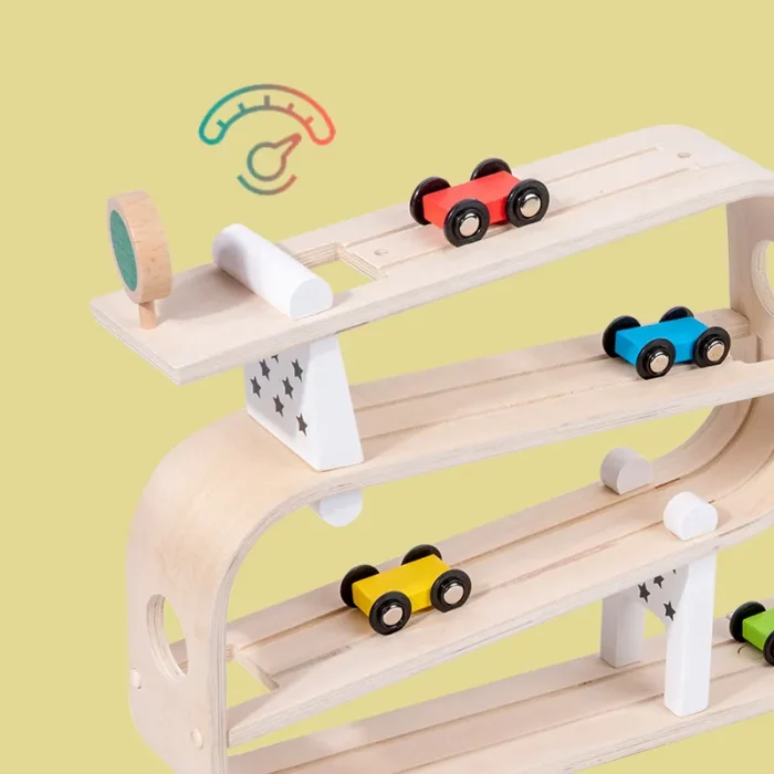 A wooden toy car track with cars on it.