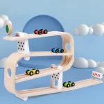 A wooden toy track with cars and clouds.