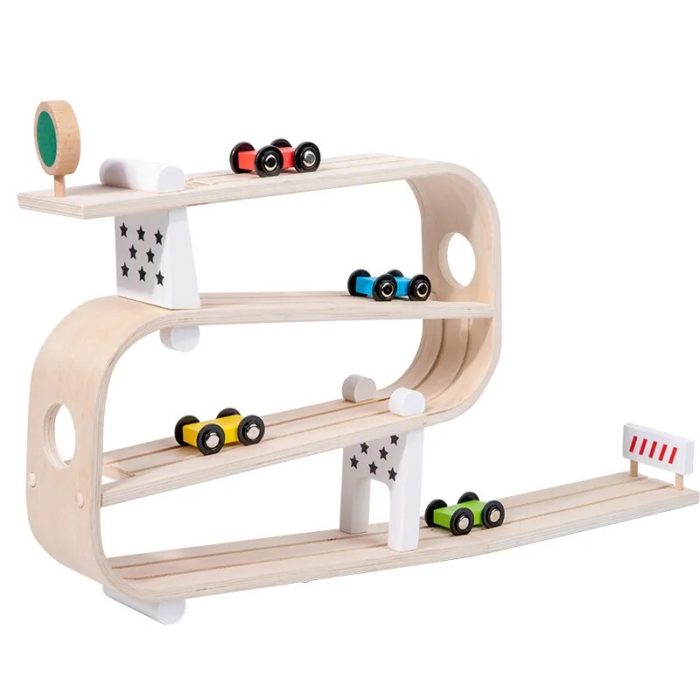 A wooden toy car track with cars on it.