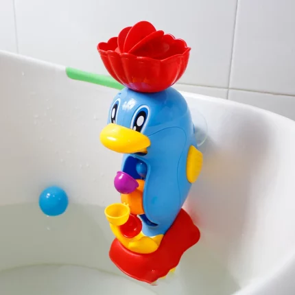 Un Jouet de Bain Déversoir à accrocher à la baignoire accroché à la baignoire.