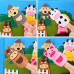 Un ensemble de quatre marionnettes à doigts en feutre - un mouton, une vache, un cheval et un cochon - sur fond de charmante ferme. Idéal pour raconter des histoires ou jouer Montessori avec "Livre Montessori la ferme des animaux".